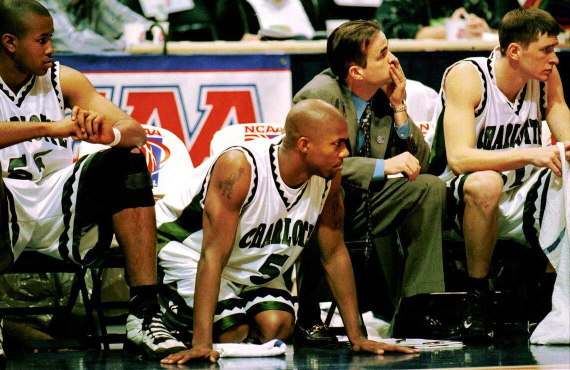 In a 1999 NCAA tournament game, Galen Young (5) knelt on the court while watching his teammates battle the Rhode Island Rams.