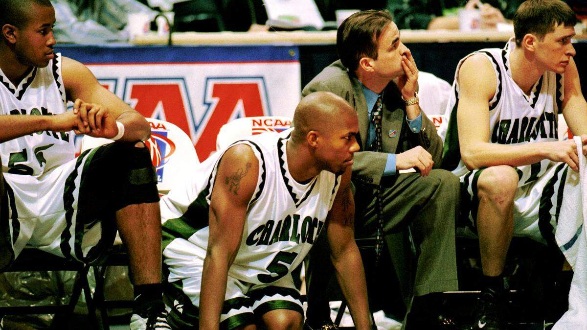 In a 1999 NCAA tournament game, Galen Young (5) knelt on the court while watching his teammates battle the Rhode Island Rams. Young was killed in a bizarre accident in 2021, at age 45.