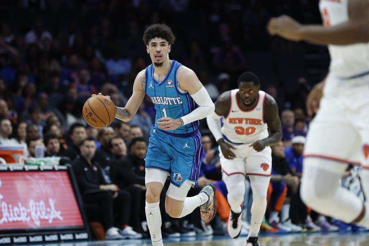 Charlotte Hornets guard LaMelo Ball (1) pushes the ball up court against the New York Knicks during the first quarter at Spectrum Center. 