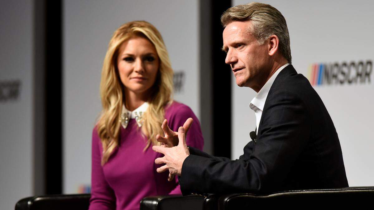 Steve Phelps, who was named NASCAR’s president on Thursday, and emcee Danielle Trotta speak during the NASCAR Marketing and Communications Summit in Charlotte in 2017.