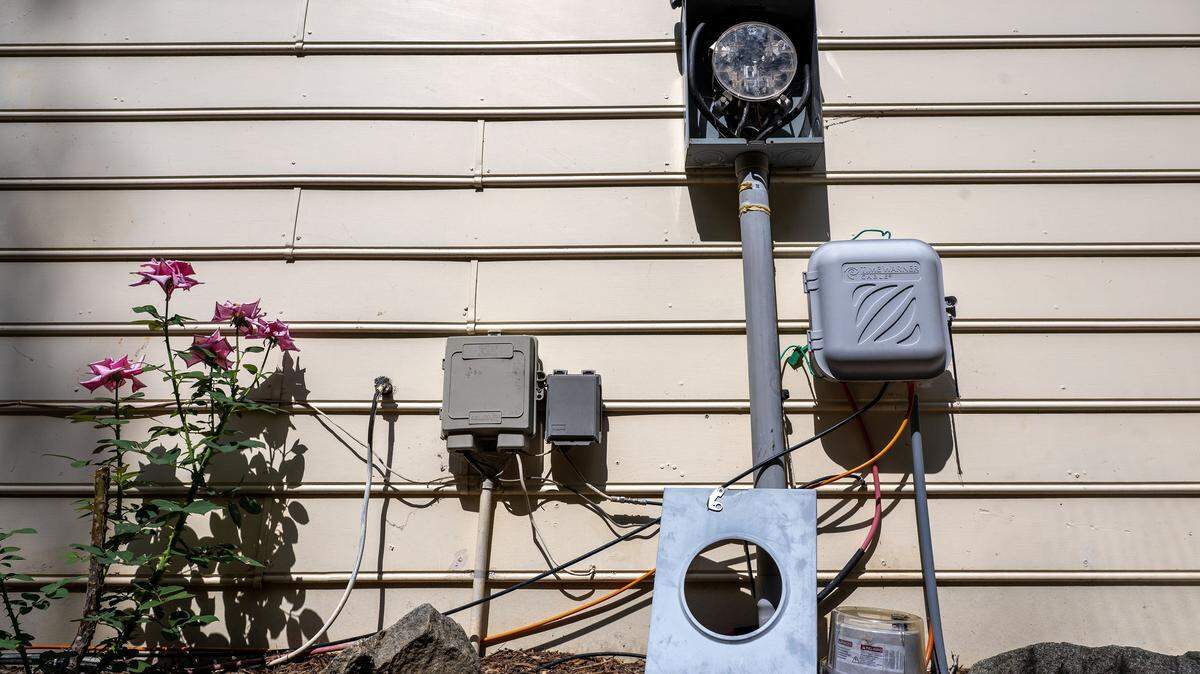 Main Street resident, Brandis Rogers has been living with power for almost a week due to a a broken electrical panel and a broken meter which has fallen out of it's case at her home in Charlotte, NC, Friday August 1, 2025.