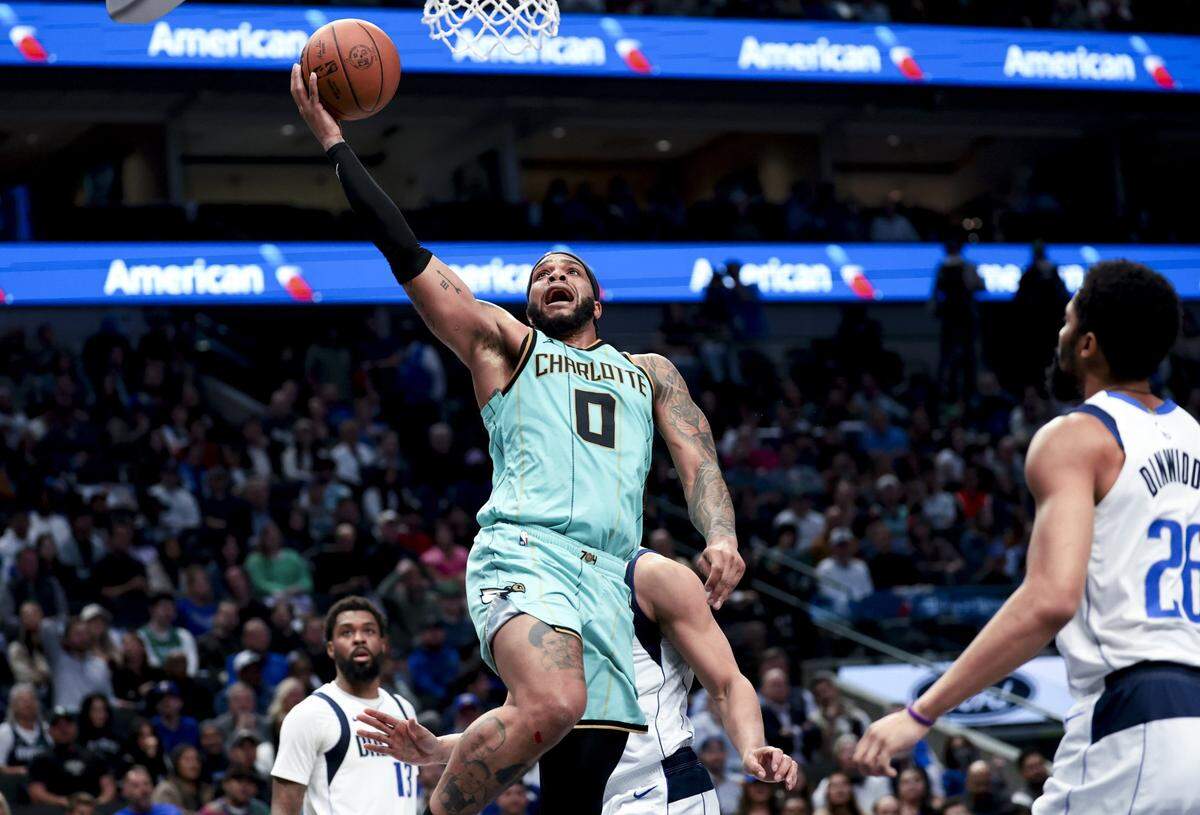Charlotte Hornets forward Miles Bridges (0) shoots against the Dallas Mavericks during the first half at American Airlines Center.