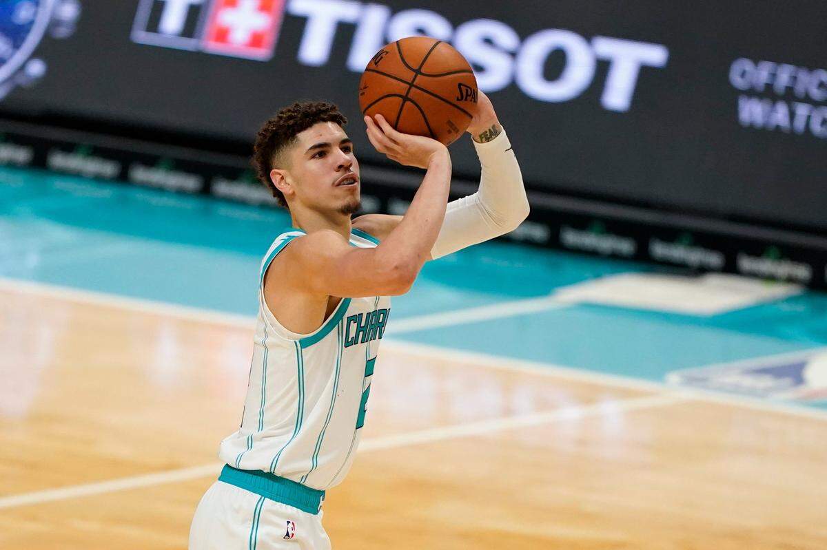 Charlotte Hornets guard LaMelo Ball shoots against the Toronto Raptors Monday in a preseason game. Ball’s form is unorthodox, as his left hand is more involved in his shooting motion than is typically taught.