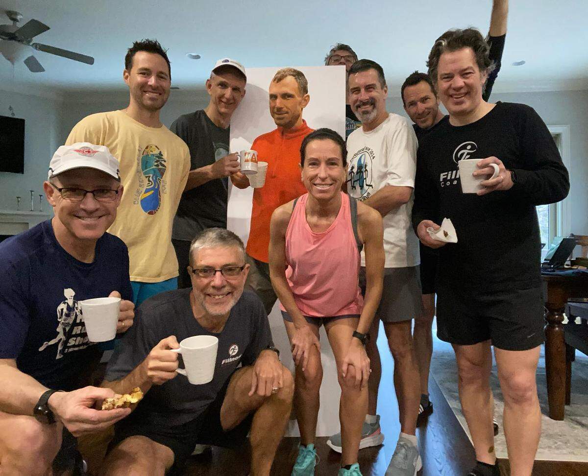 Frank Turner’s running friends pose with a cardboard cutout of Frank while he was recovering from his most recent surgery.