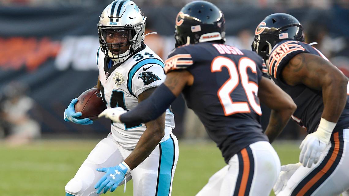Carolina Panthers running back Cameron Artis-Payne (34) looks to rush past Chicago Bears defensive back Deon Bush (26) and linebacker Kevin Pierre-Louis (57) in the first quarter at Soldier Field in Chicago, IL on Thursday, August 8, 2019.