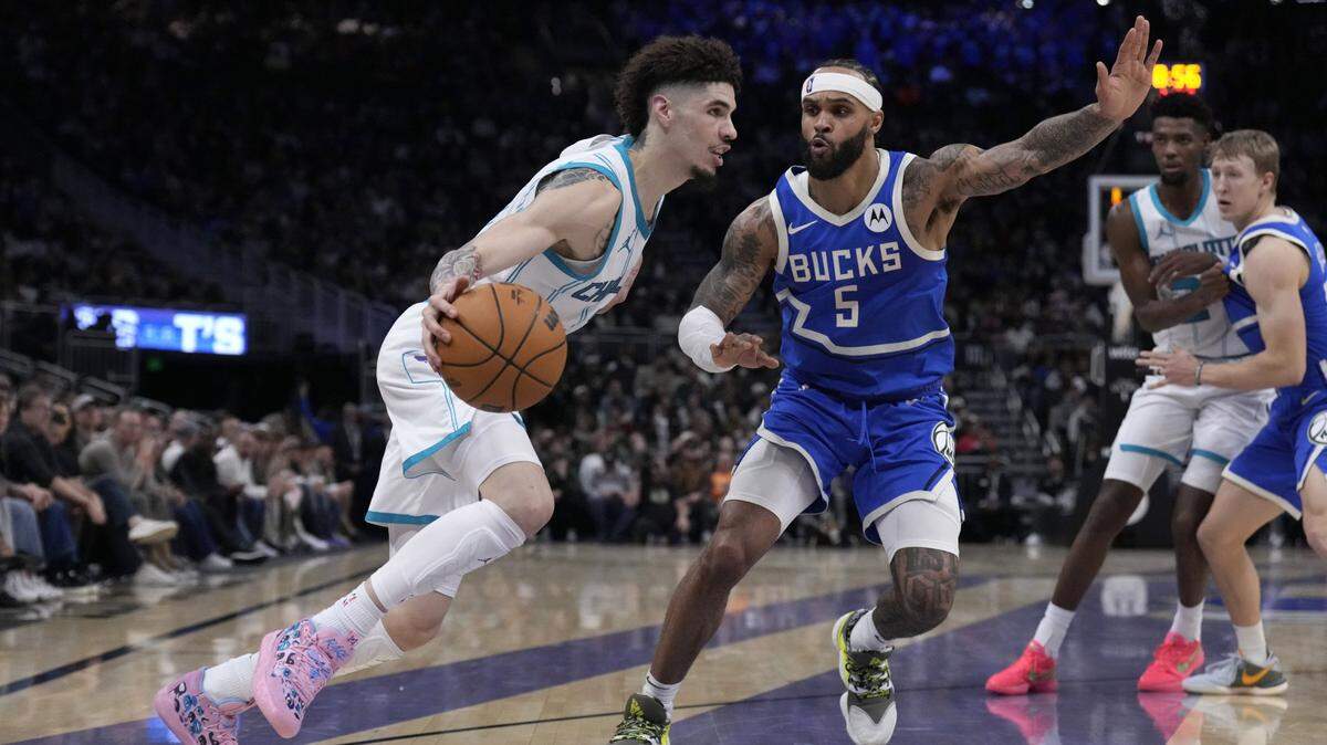 Charlotte Hornets guard LaMelo Ball (1) drives to the basket against Milwaukee Bucks guard Gary Trent Jr. (5) in the second half at Fiserv Forum.