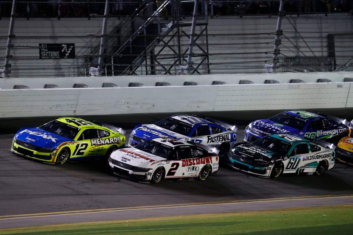 Feb 16, 2025; Daytona Beach, Florida, USA; NASCAR Cup Series driver Ryan Blaney (12) and driver Austin Cindric (2) lead the field during the Daytona 500 at Daytona International Speedway.