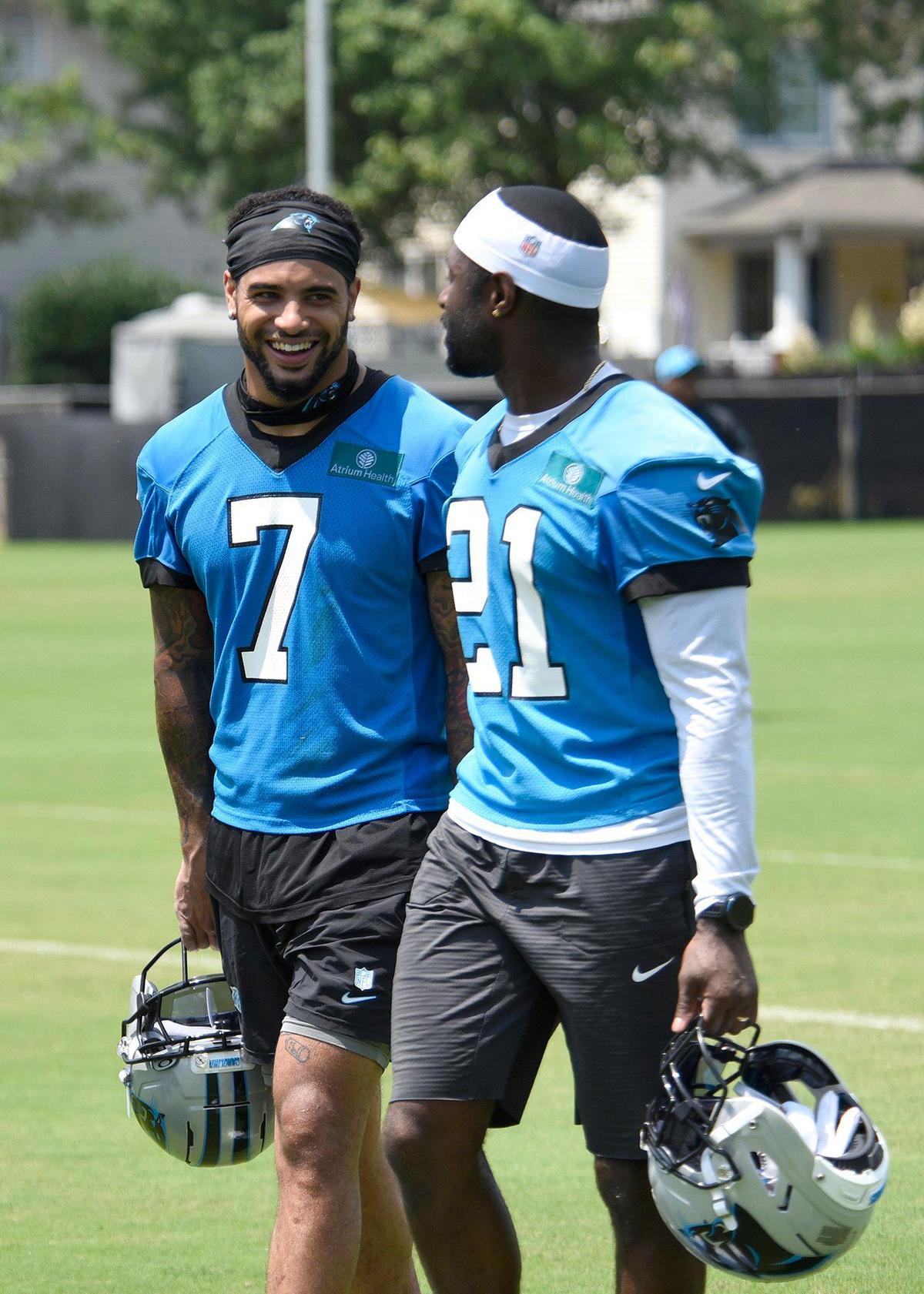Trevor Moehrig, #7, and Nick Scott, #21, Panthers safeties, walk off the practice field. The Carolina Panthers, in their second week of organized team activities, ran through drills on Tuesday, June 3, 2025 at their practice facility in uptown Charlotte.