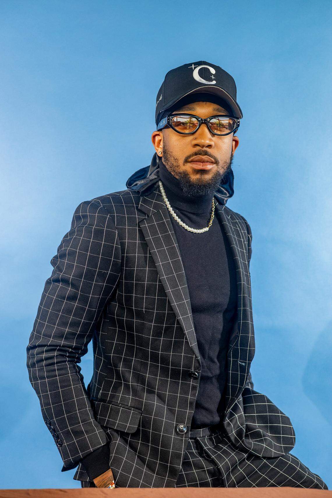 Fashion designer TeeJay Alston poses for a portrait. Alston is among four designers featured in a new exhibit “Superfine at the Gantt: Exploring Black Dandyism,” an evening long program, fashion show and panel, taking place May 2 at the Gantt Center for African American Arts & Culture.