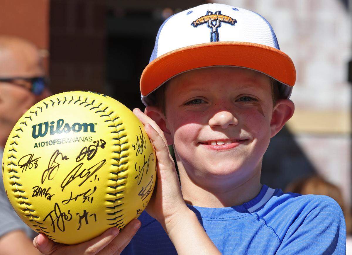 Nolan Miller of Dallas, NC poses with his freshly autographed Banana Ball outside Truist Field in Charlotte, NC on Thursday, June 4, 2026. Miller and his family enjoyed Banana Ball action between the Texas Tailgaters and Firefighters.