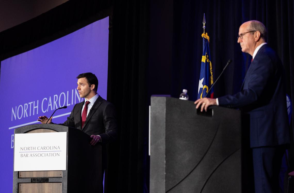 Jeff Jackson, left, debates Dan Bishop in the Attorney General race at the Charlotte Convention Center in Charlotte, N.C., on Friday, June 21, 2024.