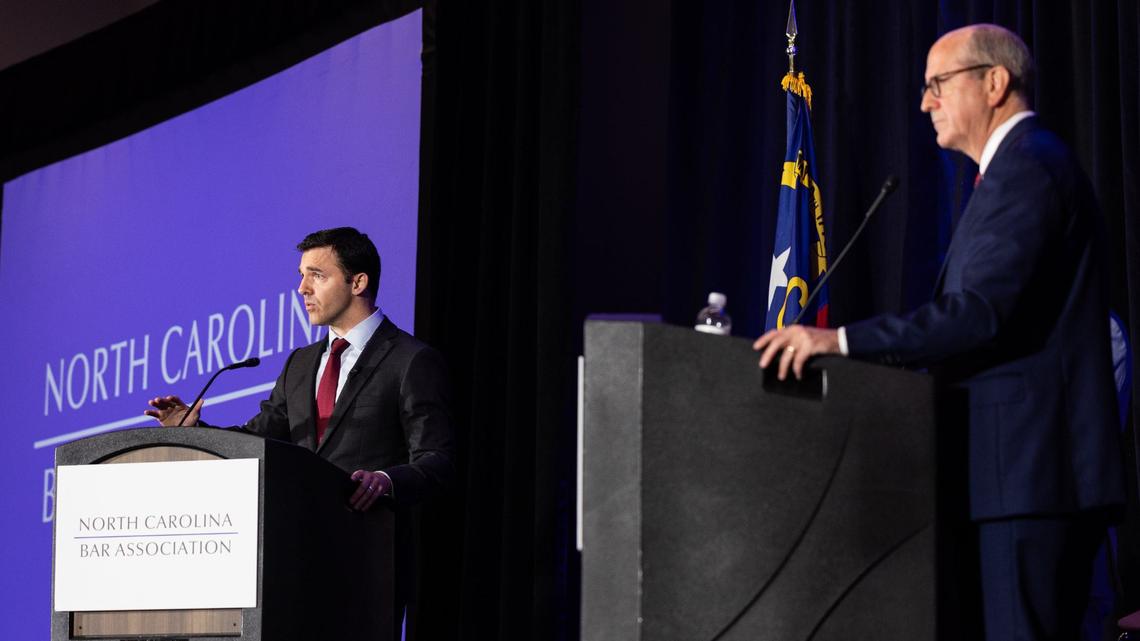 Jeff Jackson, left, debates Dan Bishop in the Attorney General race at the Charlotte Convention Center in Charlotte, N.C., on Friday, June 21, 2024.