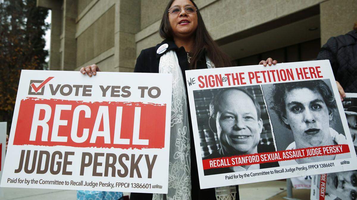 Ana Gabriela Hermosillo joins in a protest calling for the recall of Santa Clara County Judge Aaron Persky at the Santa Clara County Registrar of Voters office in San Jose, Calif., Thursday, Jan. 11, 2018. Voters are a big step closer to getting an opportunity to decide whether to oust Persky for his handling of a sexual assault case involving Stanford swimmer Brock Turner.