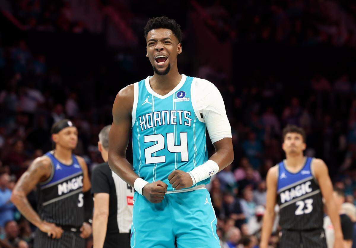 Charlotte Hornets guard Brandon Miller celebrates with the fans after Orlando Magic head coach Jamahl Mosley received two technicals and was ejected from the game at Spectrum Center in Charlotte, North Carolina, on Thursday, March 19, 2026.
