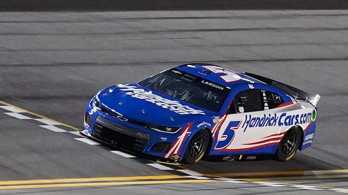 Kyle Larson crosses the finish line during qualifying for the NASCAR Daytona 500 auto race Wednesday, Feb. 16, 2022, at Daytona International Speedway in Daytona Beach, Fla. Larson took the pole position for Sunday’s race. (AP Photo/Chris O’Meara)