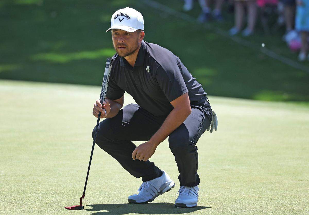Xander Schauffele lines up a putt on the second green during the final round of the Wells Fargo Championship at Quail Hollow Club in Charlotte, NC on Sunday, May 12, 2024.