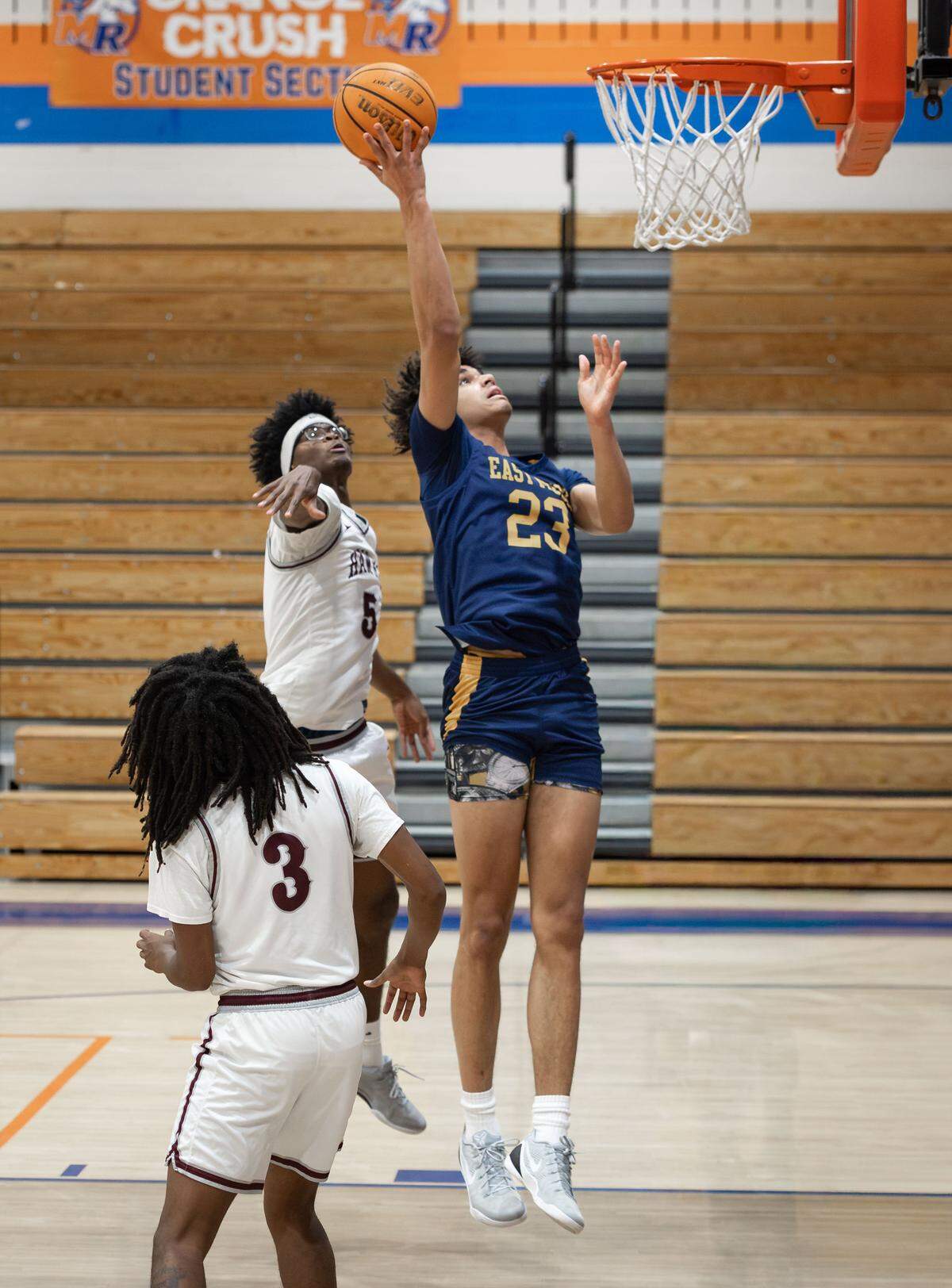 East Meck's Jordan Buzzard (23) grabs the rebound and goes back up with the 2-point basket. West Meck Men's basketball team would take on East Meck at the Phenom Hoops Mike Gminski Classic at Marvin Ridge High School December 27, 2025.