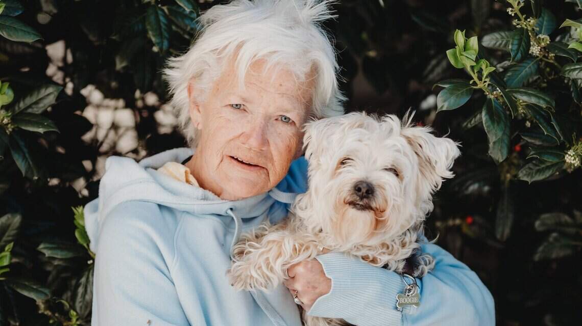 She and her dog lived in a shopping center for two years. Then along came a stranger.