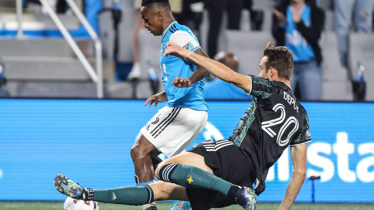 Charlotte FC Yordy Reyna, left, battles LA Galaxy Nick DePuy for the ball at the Bank of America Stadium in Charlotte, N.C., on Saturday, March 5, 2022.