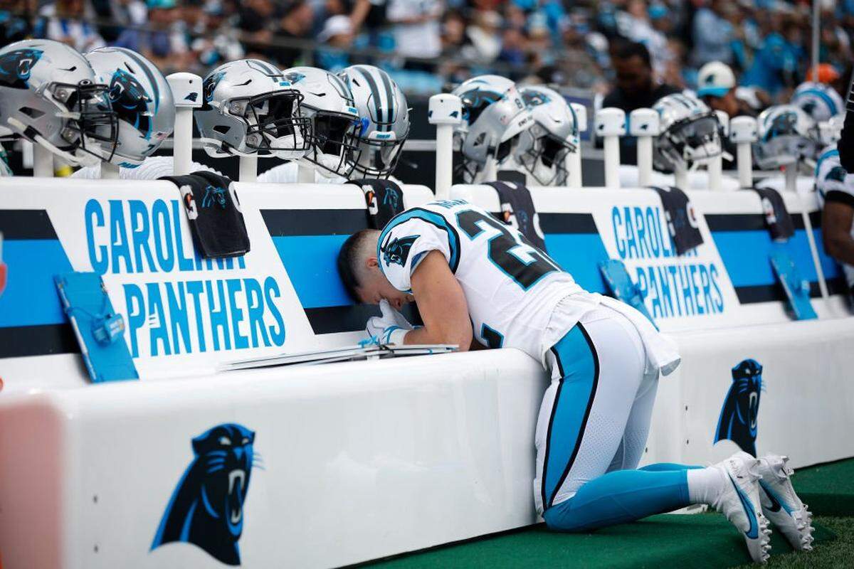 CHARLOTTE, NORTH CAROLINA - OCTOBER 02: Christian McCaffrey #22 of the Carolina Panthers takes a moment before the game against the Arizona Cardinals at Bank of America Stadium on October 02, 2022 in Charlotte, North Carolina. (Photo by Jared C. Tilton/Getty Images)