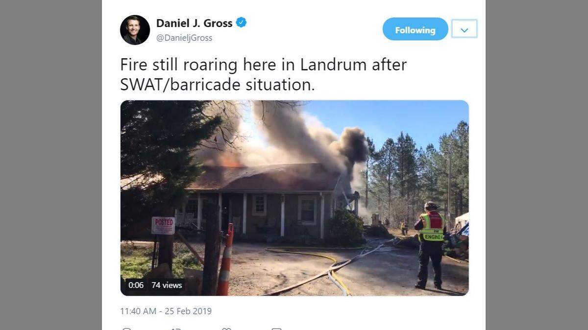 A man set fire to a home after US Marshals showed up with a warrant on kidnapping charges, police say.