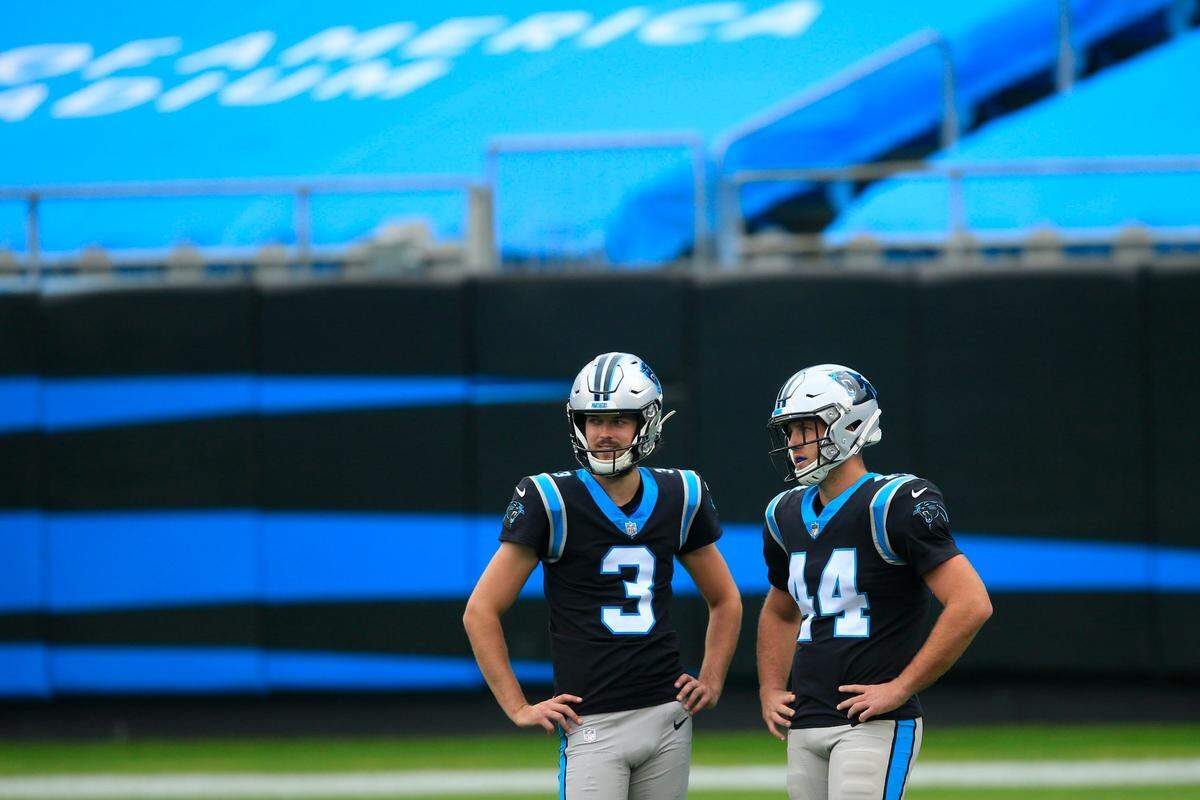 Carolina Panthers punter Joseph Charlton (3) and Carolina Panthers long snapper J.J. Jansen (44) speak before the first half of an NFL football game against the Tampa Bay Buccaneers, Sunday, Nov. 15, 2020, in Charlotte , N.C. (AP Photo/Brian Blanco)