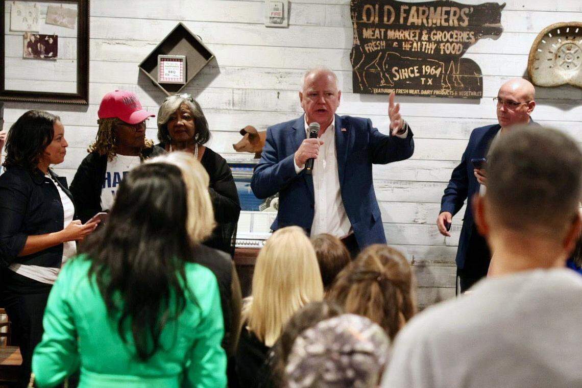 Democratic vice presidential nominee Tim Walz speaks to people dining at RayNathan’s restaurant in Gastonia Sunday.