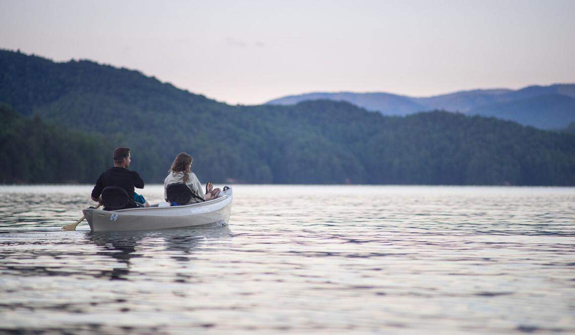 A couple canoes at sunset on Lake James.
