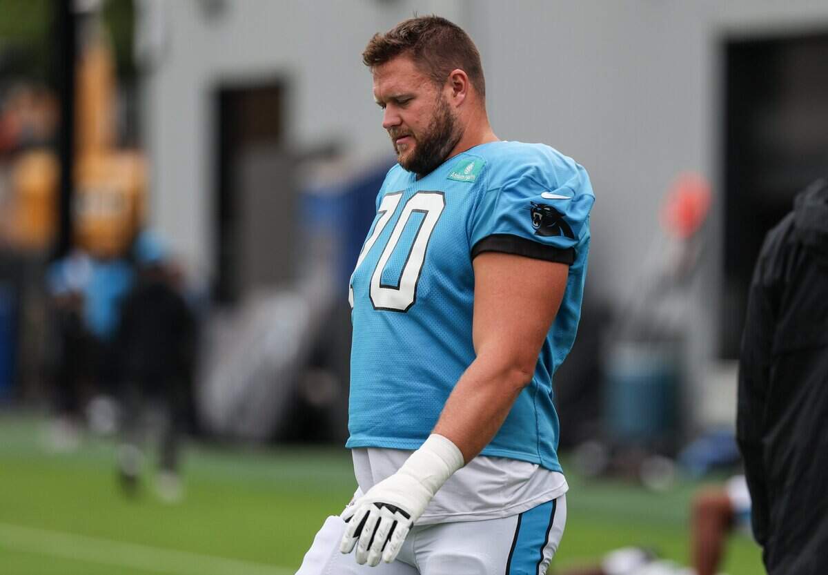 Panthers outside lineman Brady Christensen walks onto the field for joint practice with the Browns at training camp in Charlotte, North Carolina, on Aug. 6, 2025.