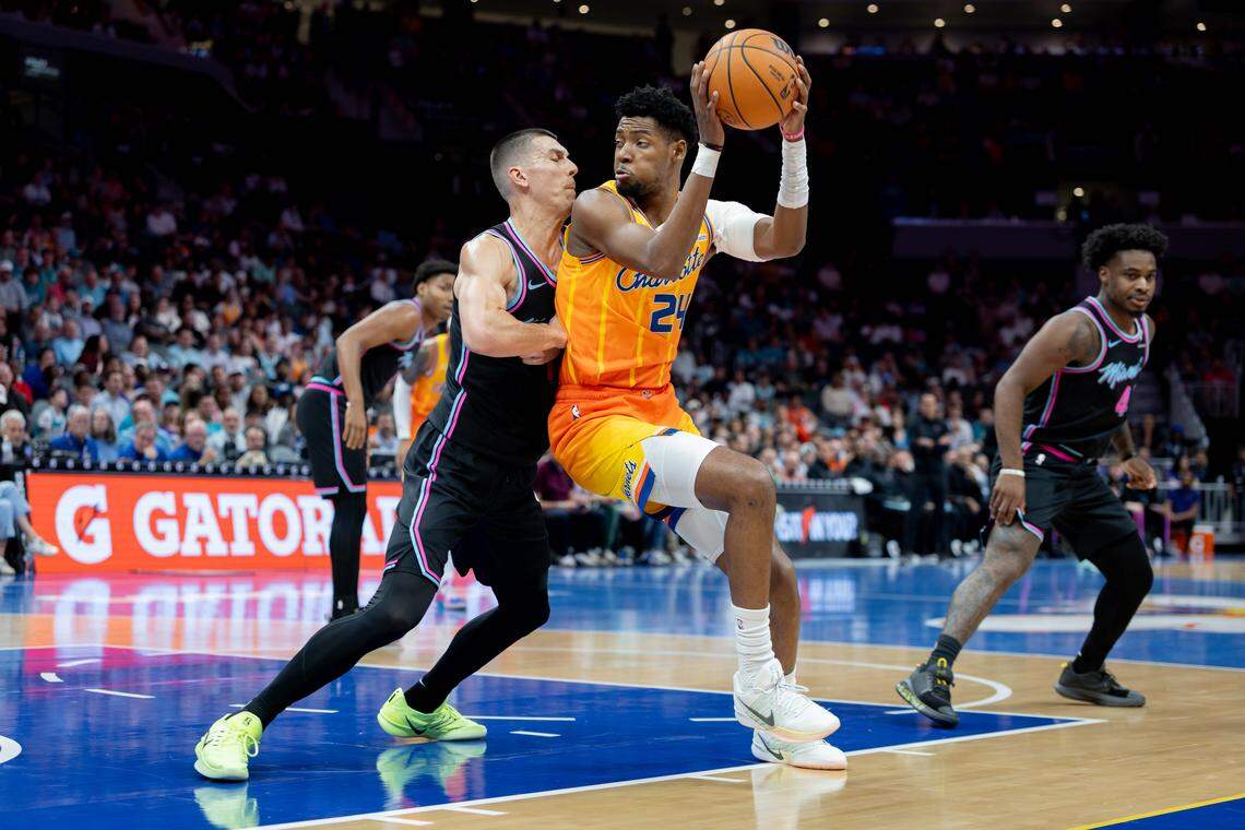 Charlotte’s Brandon Miller backs down the Miami Heat’s Tyler Herro during early first-half action on Friday, March 6, 2026.