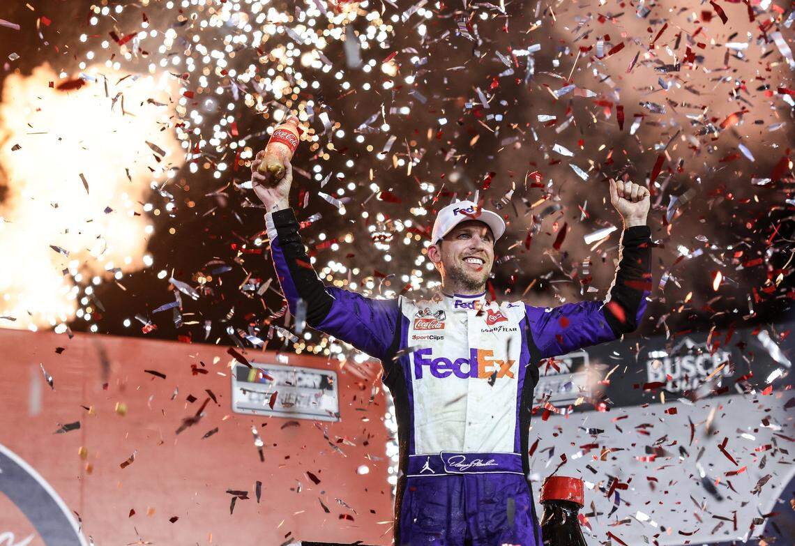 Denny Hamlin celebrates after winning the Coca-Cola 600 in Concord, N.C., on Sunday, May 29, 2022. It was Hamlin’s first win in the Coke 600 and came in double overtime.