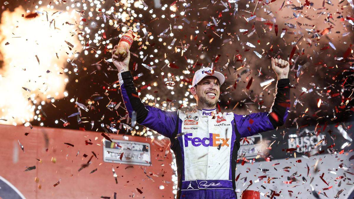 Denny Hamlin celebrates after winning the Coca-Cola 600 in Concord, N.C., on Sunday, May 29, 2022. It was Hamlin’s first win in the Coke 600 and came in double overtime.