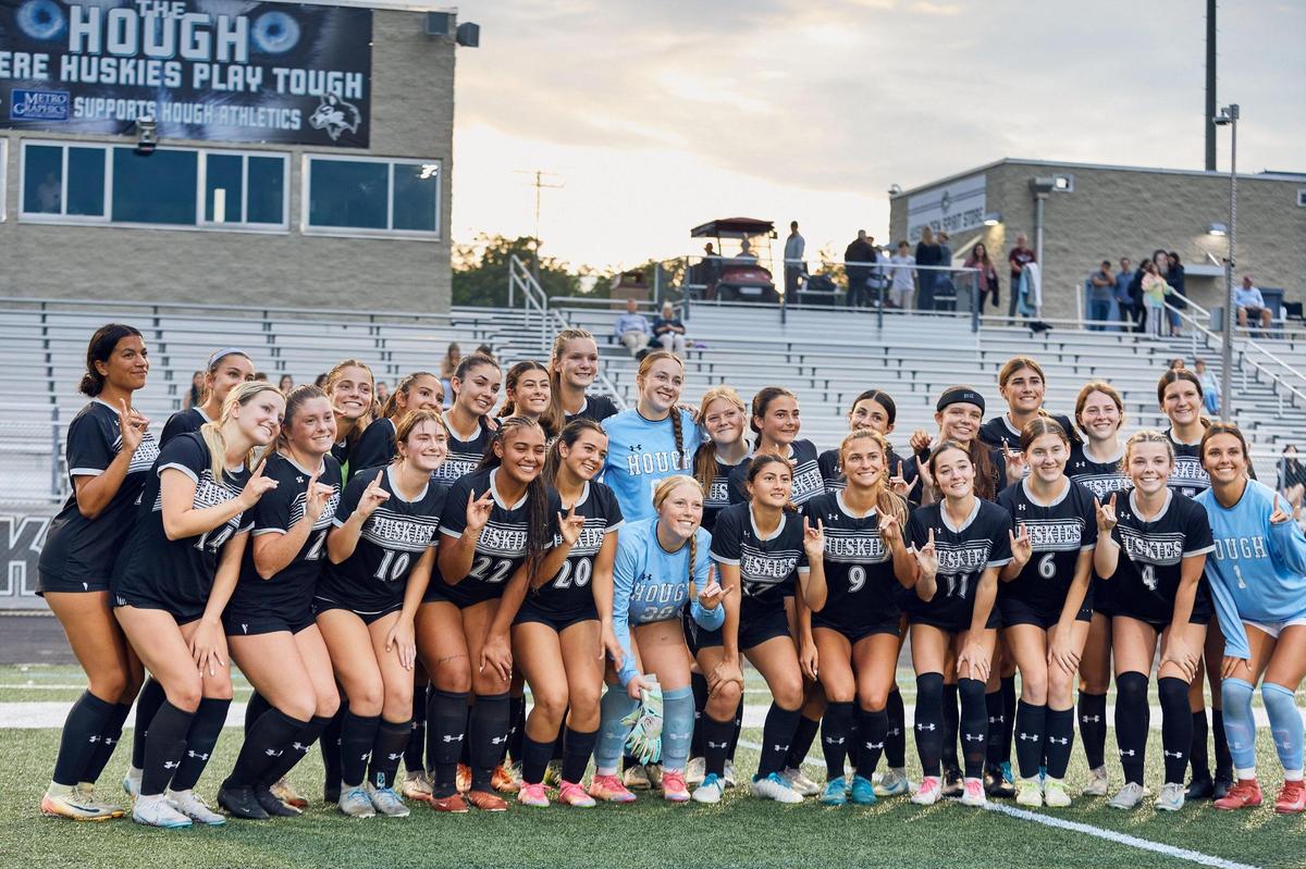 Hough Girl’s Soccer team celebrates following the Huskies win over West Charlotte. The Hough Huskies won 10-0 after a mercy rule following halftime.