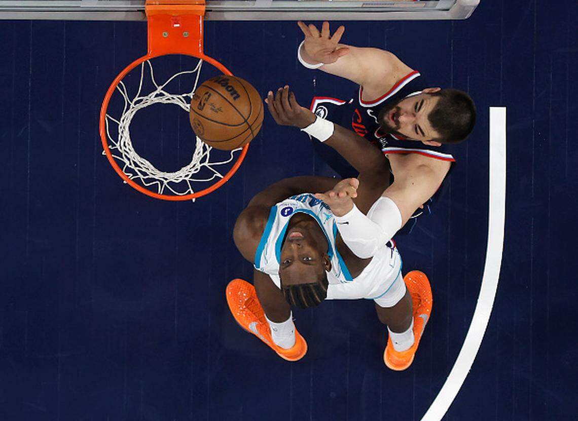 Moussa Diabate of the Charlotte Hornets and Ivica Zubac #40 of the LA Clippers in the first half at Intuit Dome in Inglewood, California.