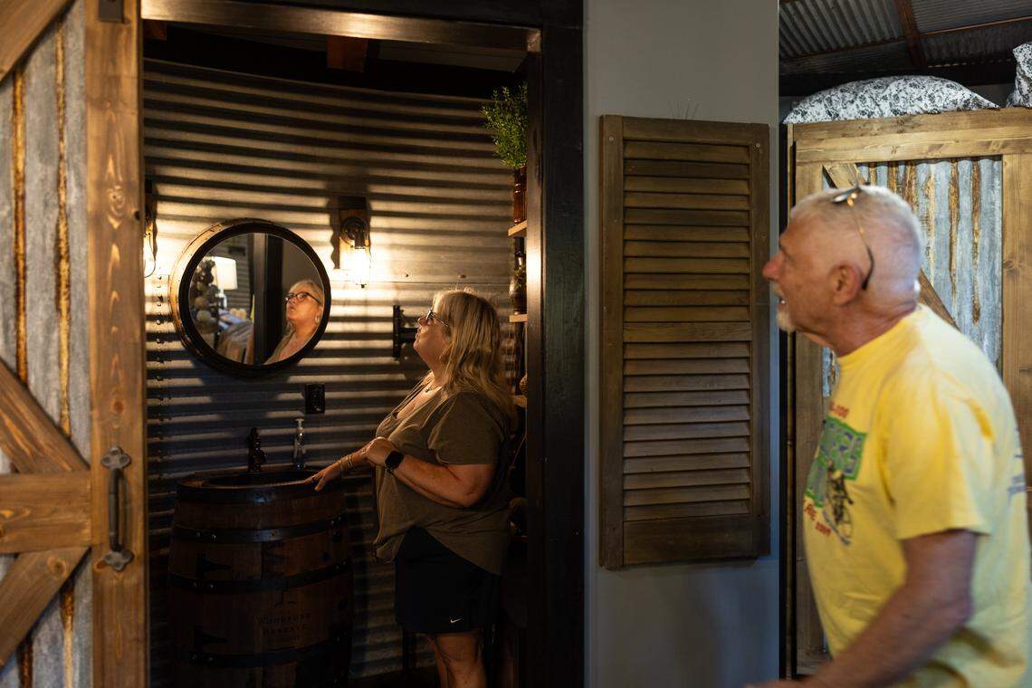 Betty, left and Tom Flohr give a tour inside the silo they converted into a short term rental property in Lincolnton, N.C., on Friday, April 3, 2026.