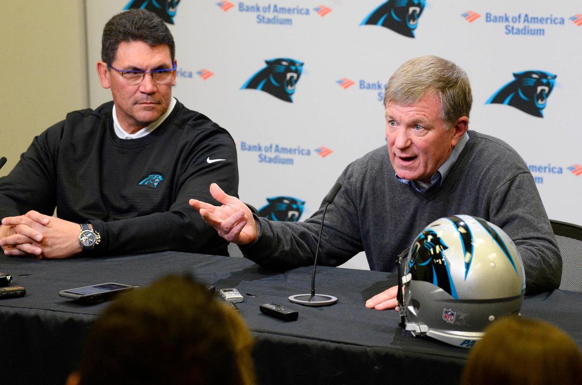 Ron Rivera (left) and general manager Marty Hurney speak at a press conference before the 2019 draft, in which they selected edge rusher Brian Burns in the first round.