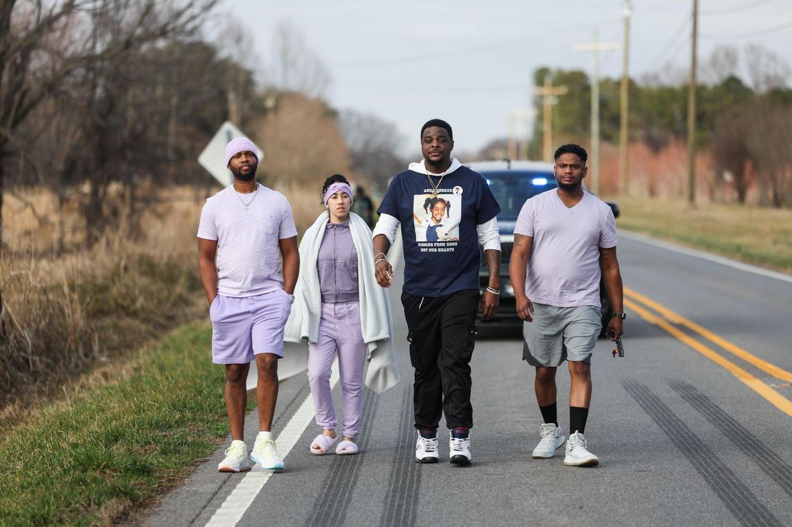 O’Bryant Degree, second from right, walks with friends along North Carolina Highway 18 during a walk to commemorate the 25th year of Degree’s younger sister, Asha, disappearing along Fallston Road in Shelby, N.C., on Saturday, Feb. 8.