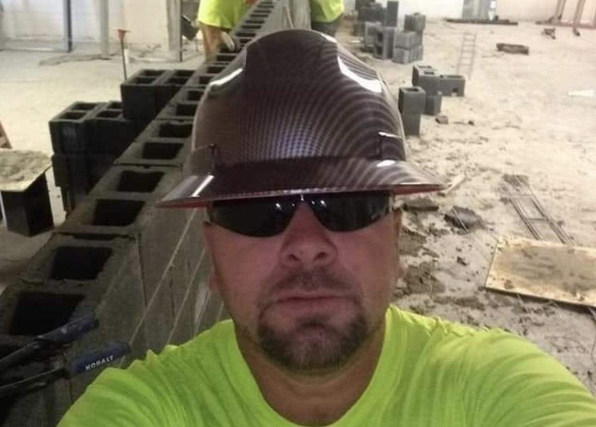 Jesus Olivares, shown here on a job site, learned masonry from his father at age 16.