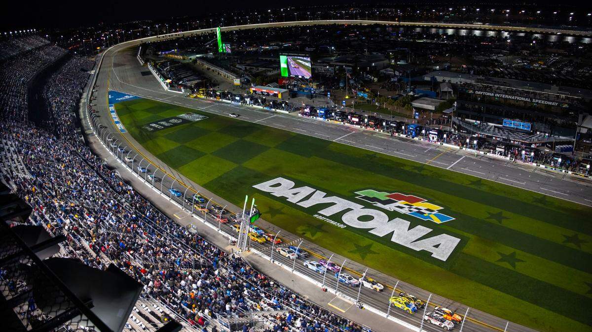 Feb 19, 2024; Daytona Beach, Florida, USA; Overall view as NASCAR Cup Series drivers race past the start finish line through the tri-oval during the Daytona 500 at Daytona International Speedway.