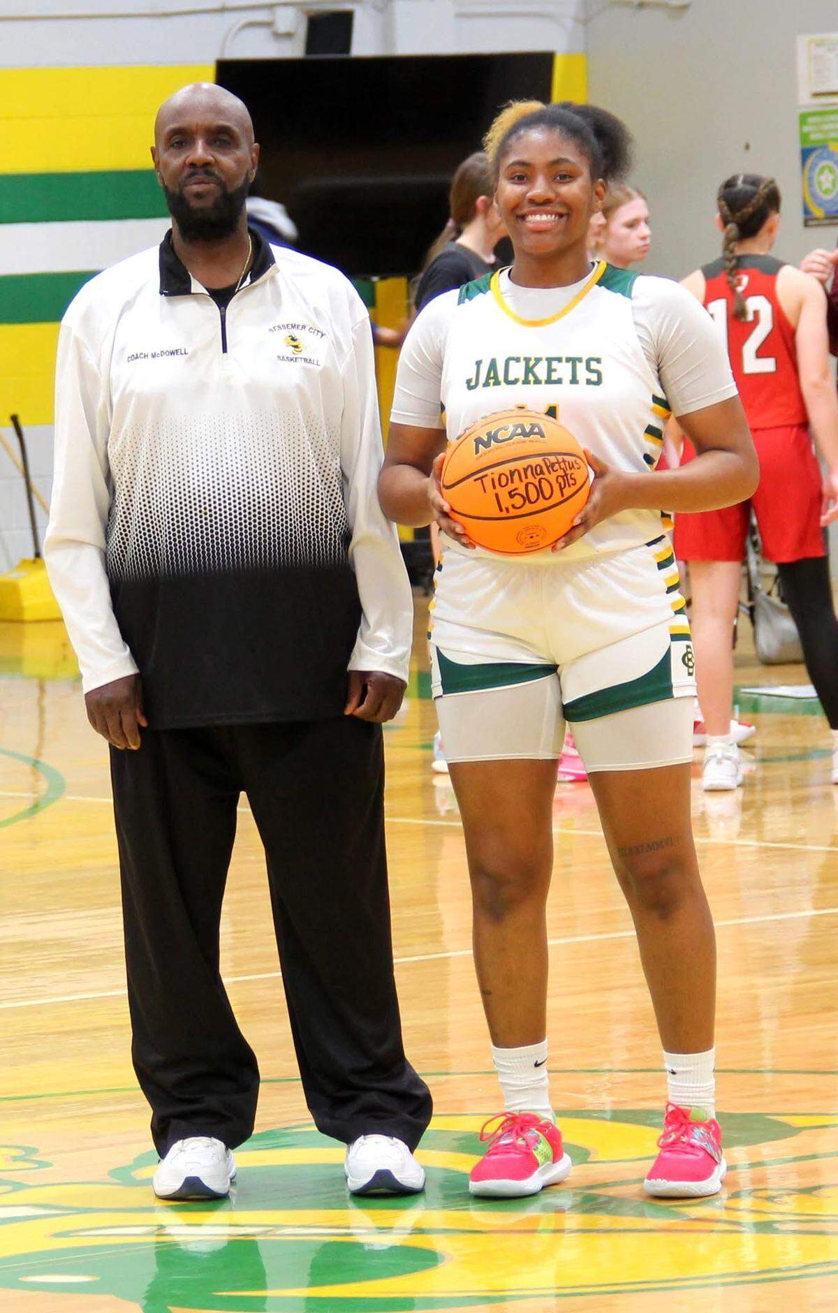 Bessemer City’s Tionna Pettus (right) scored her 1,500th career point in a win over Piedmont Charter Tuesday