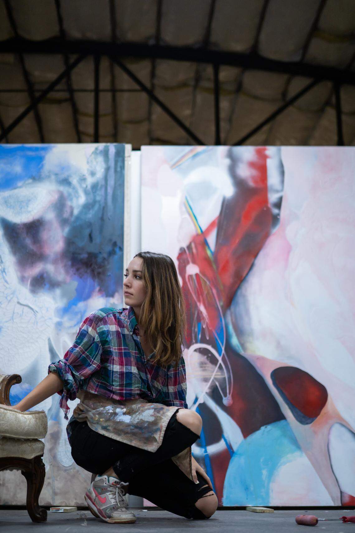Katherine Boxall works in her West Charlotte studio. A teacher once told Boxall that “real painters paint big,” so she does. She works on large canvas, 6 by 8 feet, using acrylic, oil, pastels, spray paint, and chalk to sketch.