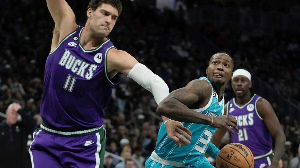 Charlotte Hornets’ Terry Rozier drives past Milwaukee Bucks’ Brook Lopez during the first half of an NBA basketball game Friday, Jan. 6, 2023, in Milwaukee. (AP Photo/Morry Gash)