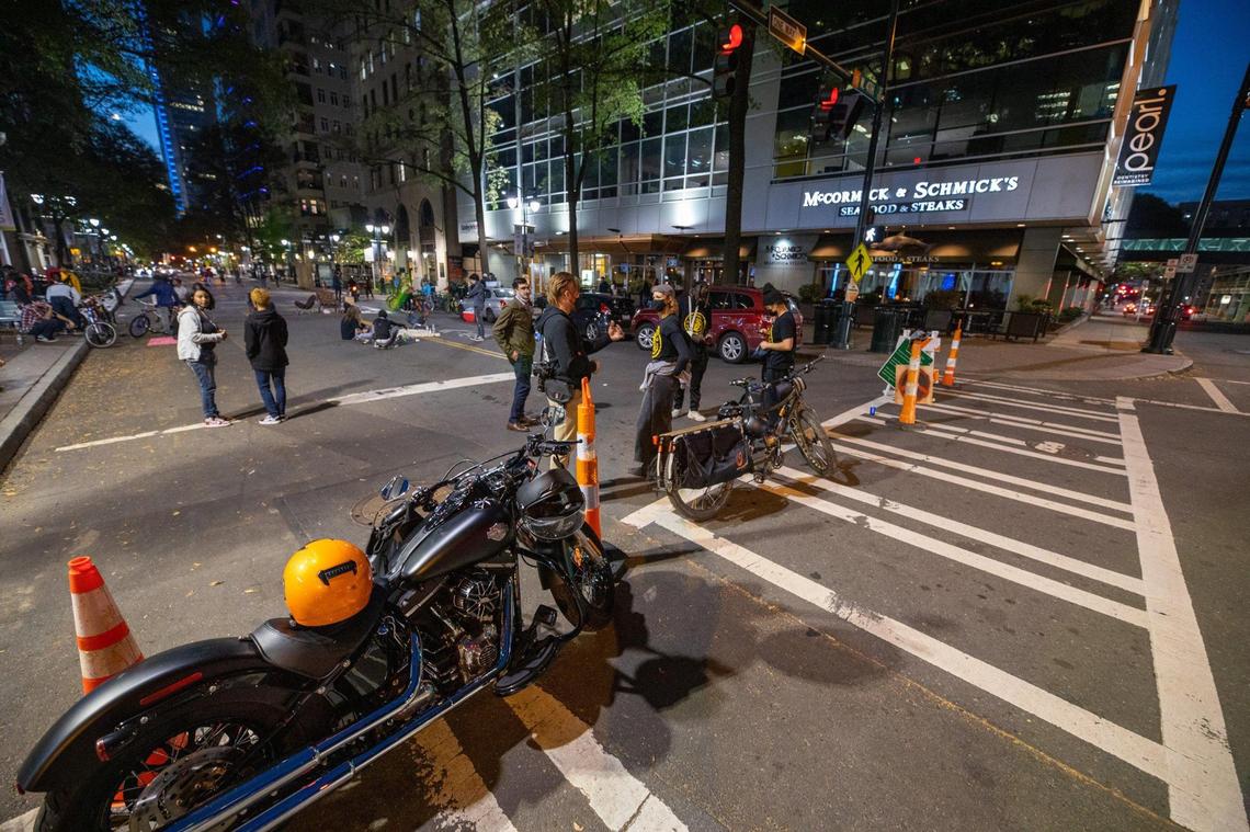 Protesters block off South Tryon Street to protect the Black Lives Matter mural from vehicles on Saturday, Nov. 14, 2020.
