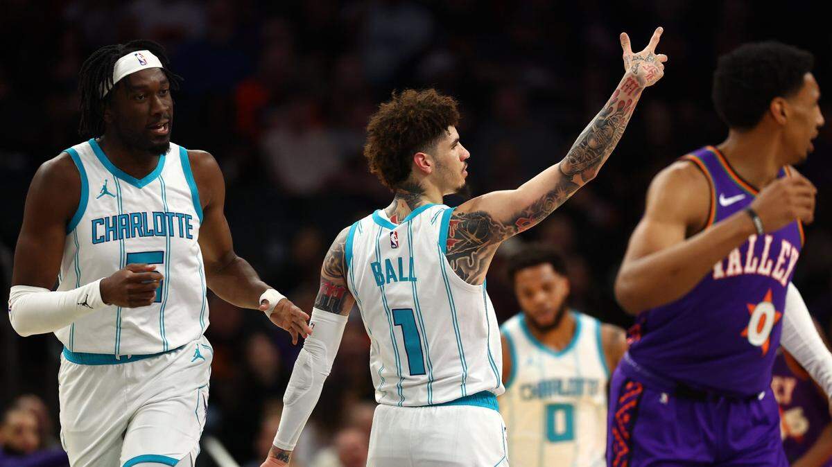 Charlotte Hornets guard LaMelo Ball (1) reacts after a basket against the Phoenix Suns during the first half at Footprint Center.