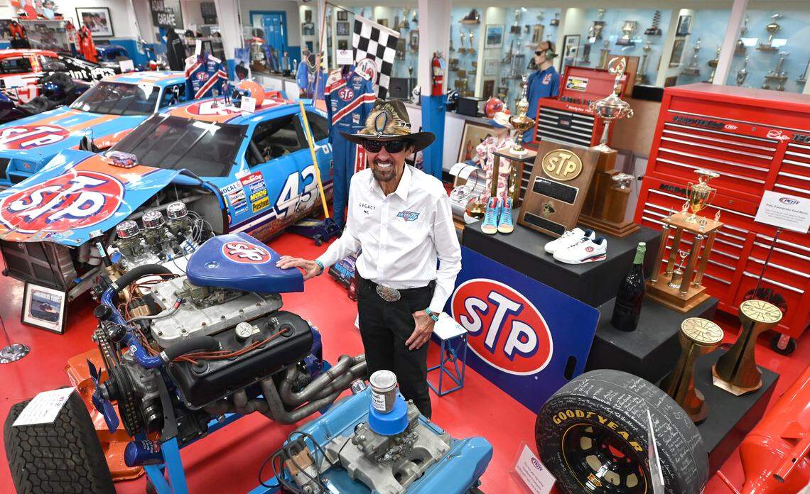 Former NASCAR driver and Hall of Fame member Richard Petty poses among some of the memorabilia from his career at The Richard Petty Museum in Level Cross, NC on Monday, January 29, 2024. Petty nicknamed “The King,” was the first driver to win the championship 7 times while recording 200 racing wins.