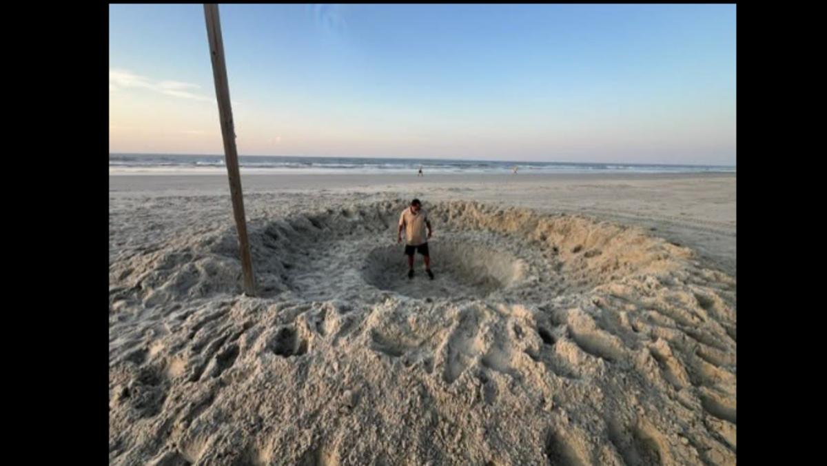 This crater was created overnight at Sunset Beach, NC, and police say the act was against the law and dangerous.