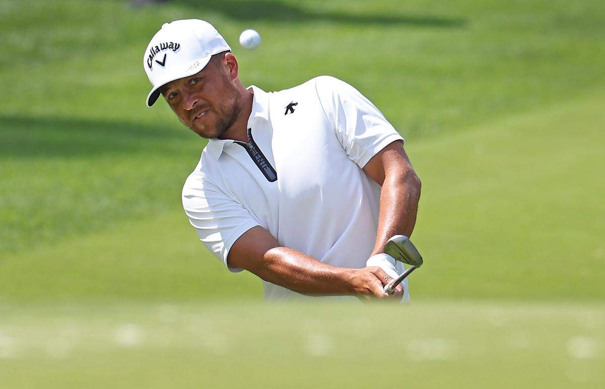 Xander Schauffele chips onto the 10th green during second round action of the Wells Fargo Championship at Quail Hollow Club in Charlotte, NC on Friday, May 10, 2024.
