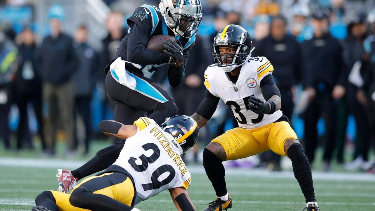 Carolina Panthers wide receiver Shi Smith (12) drives down field against Pittsburgh Steelers safety Minkah Fitzpatrick (39) and Pittsburgh Steelers cornerback Arthur Maulet (35) during a game at Bank of America Stadium in Charlotte, N.C., Sunday, Dec. 18, 2022.