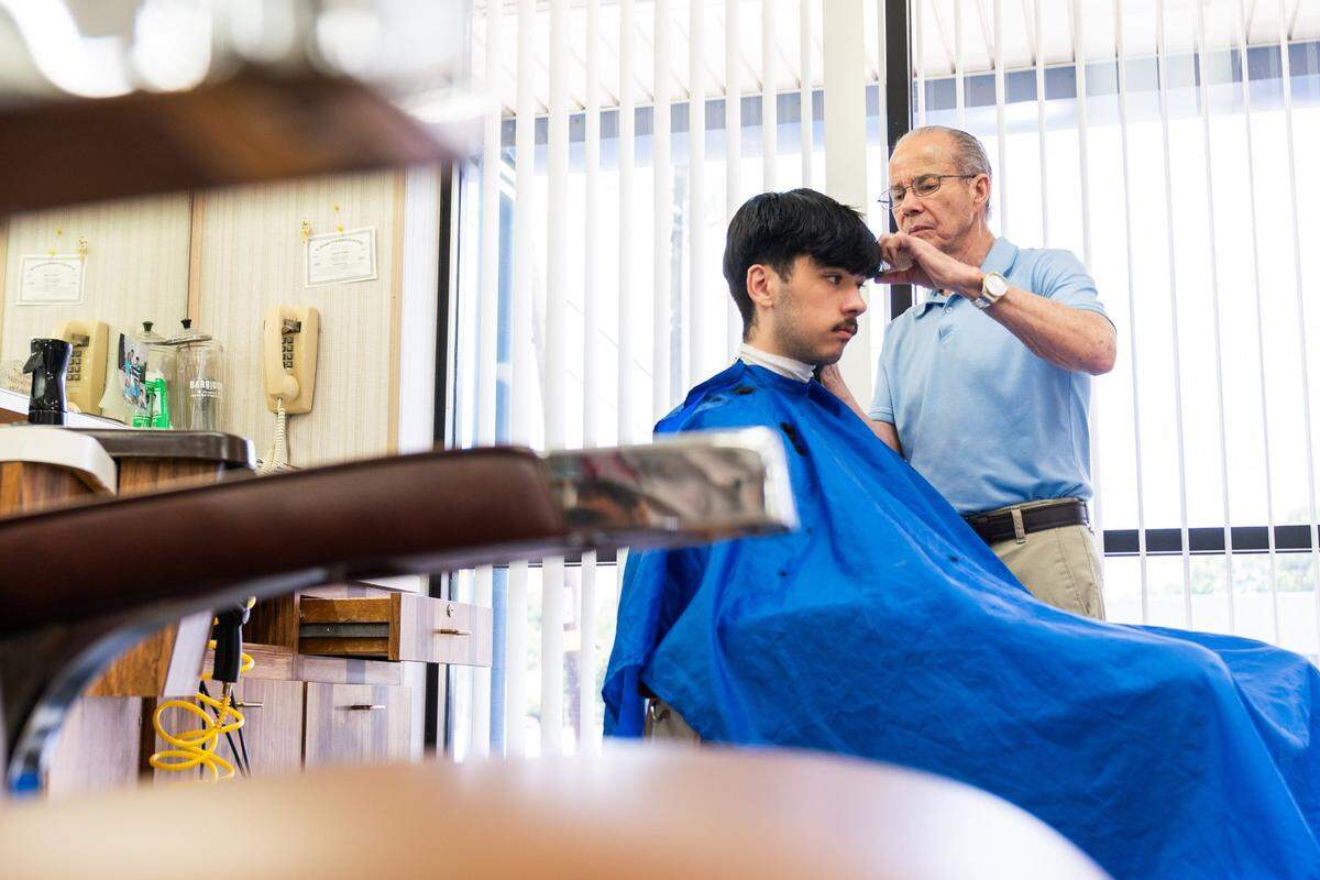 Gary Carter cuts Andrew Garcia’s hair on Wednesday. Garcia has been coming to Gary’s Barber Shop for three years now. At the end of the month, Carter is closing his barbershop at the end of the month; it’s been there for 59 years.