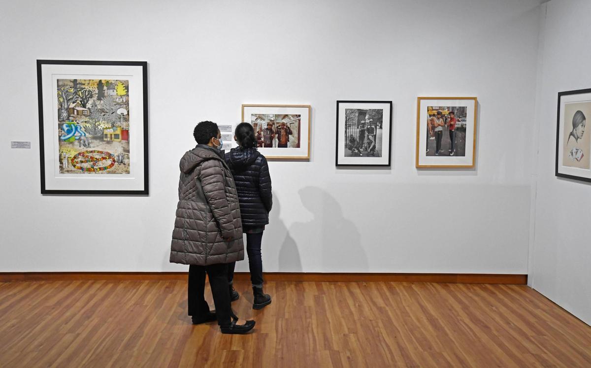Museum-goers view artwork in the “Vision & Spirit: African American Art” exhibit from the Bank of America collection at the Harvey B. Gantt Center for African-American Arts + Culture in Charlotte on March 19.